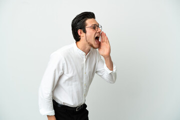 Russian Business man isolated on white background shouting with mouth wide open to the side