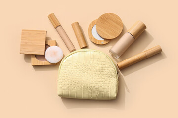 Cosmetic bag with eco-friendly makeup products on beige background