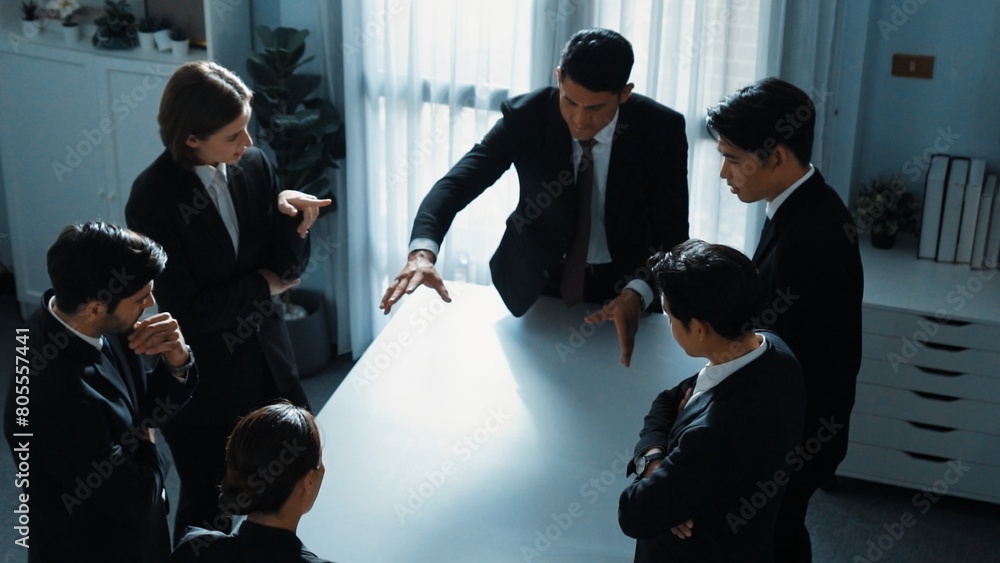 Poster top view of project manager looking at meeting table surrounded by diverse business people brainstor
