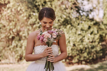 Garden, woman and happy as bride with flowers for wedding, love and anniversary ceremony. Female...