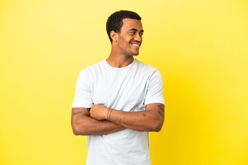 African American handsome man on isolated yellow background happy and smiling