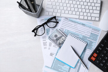 Tax accounting. Flat lay composition with stationery and documents on light grey table. Space for text