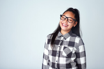 Studio, fashion and portrait of girl with glasses for clear vision, eye care and optometry. Kid,...
