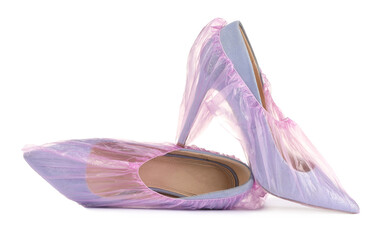 High heels in pink shoe covers isolated on white