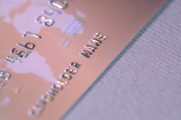 One credit card on light background, closeup