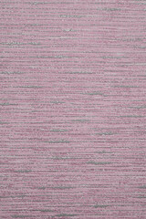 Pink wallpaper sheet as background, top view
