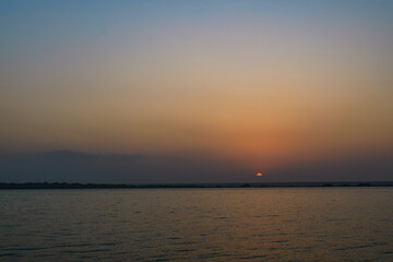 Fototapeta na wymiar Sunset at Golden hour in the ocean
