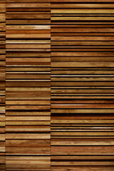 A close-up photo for background material of a wall made of many layers of long thin boards