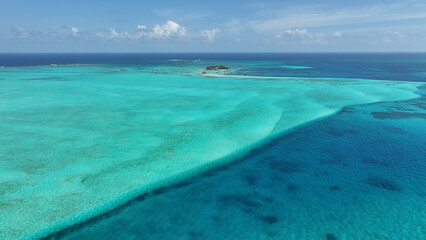 Blue Bay Water At San Andres In Caribbean Island Colombia. Colombian Caribbean Beach. Blue Sea Background. San Andres At Caribbean Island Colombia. Tourism Landscape. Nature Seascape.