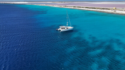 Sailboat Sailing At Kralendijk In Bonaire Netherlands Antilles. Island Beach. Blue Sea Landscape....