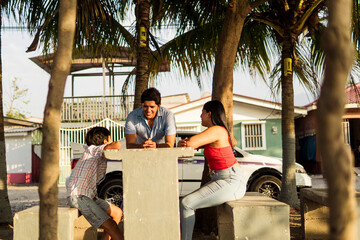 Hispanic Family Enjoying Outdoor Conversation in Latin America