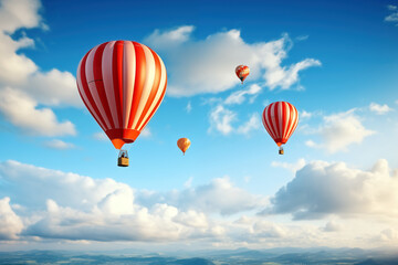Fototapeta premium Hot air balloons flying high in blue sky. Background with selective focus and copy space