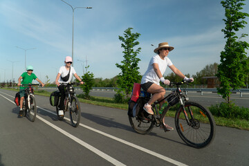 family riding a bike, family sport, teenagers riding a bike, cycling, traveling, traveling on a bike,