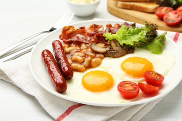 Delicious breakfast with sunny side up eggs served on white table, closeup