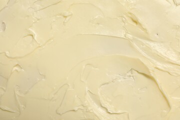 Texture of fresh natural butter as background, top view
