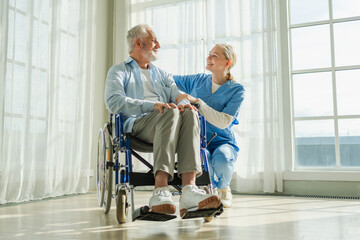Help support retirement healthcare. Nurse helping old man in wheelchair. Patient and woman in...