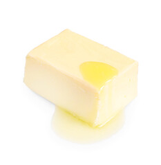 Piece of melting butter on white background