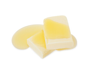 Pieces of melting butter isolated on white