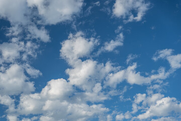 A bright blue sky full of clouds
