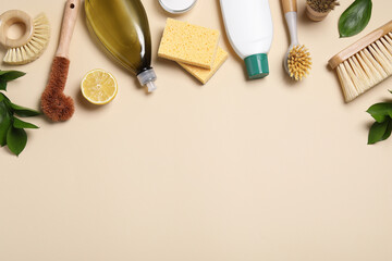 Flat lay composition with different cleaning supplies on beige background. Space for text