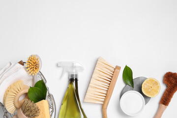 Flat lay composition with different cleaning supplies on white background, space for text