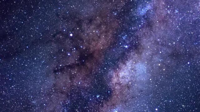 Looped abstract repetitive background, flying through the vast expanse of the universe. Moving through space past constellations and galaxies. Endless futuristic space journey. High quality 4k footage