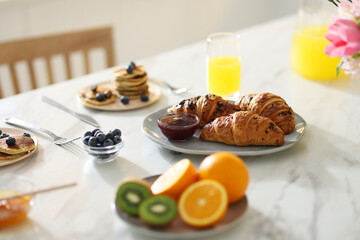 Tasty breakfast. Fresh croissants with jam on white marble table, selective focus - Powered by Adobe
