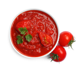 Homemade tomato sauce in bowl and fresh ingredients isolated on white, top view