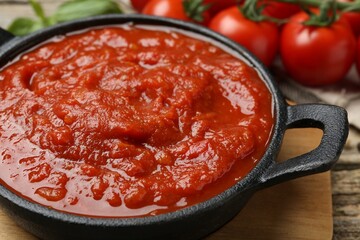 Homemade tomato sauce in bowl on table, closeup