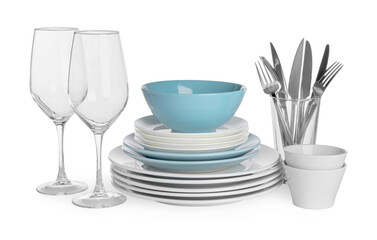 Set of beautiful ceramic dishware, glasses and cutlery isolated on white