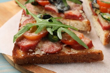 Tasty pizza toasts on table, closeup view