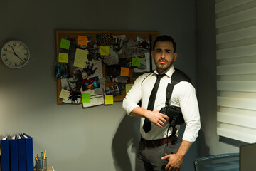 Focused detective in a dimly lit office, ready with his gun beside an evidence board