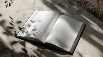 Open book with shadow on concrete background.