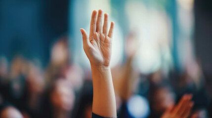 Raised hand on a blurred background. Symbol of rallies and protests