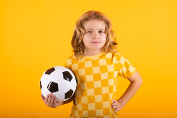 Kid holding football ball in studio. Kid playing football. Sport, soccer hobby for kids. Little boy holding soccer ball. Fan sport boy football player with football ball.