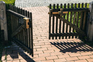 Wooden door fence for the entrance towards an old heritage house in the village of Kumrovec, home...