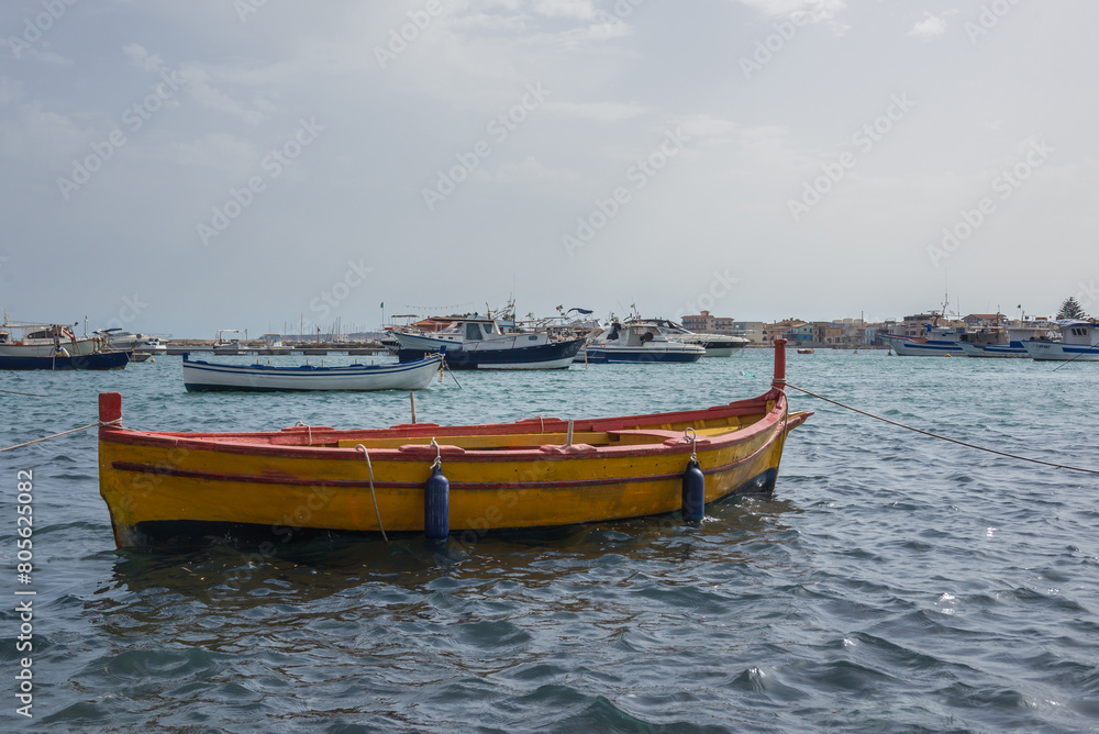 Wall mural Yellow fishing boat in port of Marzamemi village on the island of Sicily, Italy