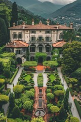 An Italian Renaissance villa with terracotta roofs is seen from above, surrounded by a garden in the front. The house features traditional architecture and the garden is lush and well-maintained