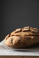 Freshly baked sourdough bread on grey table. Space for text