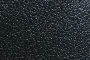 Black natural leather as background, top view