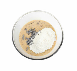 Raw dough with chocolate chips in bowl isolated on white, top view