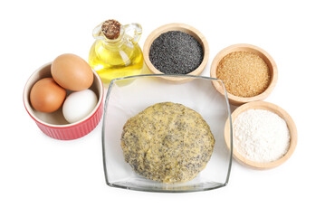 Raw dough with poppy seeds in bowl and ingredients isolated on white, top view