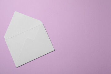 Letter envelope on violet background, top view. Space for text