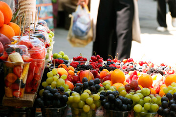 assorted fresh berries (berry) fruits in a street stall for sell
