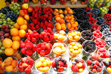 Naklejka na ściany i meble assorted fresh berries (berry) fruits in a street stall for sell
