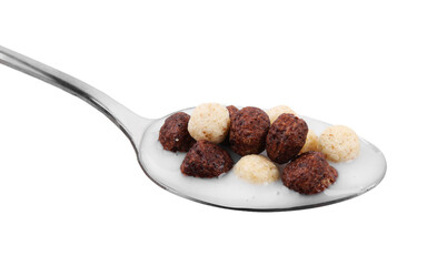 Cereal balls and milk in spoon isolated on white