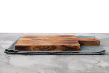Wooden cutting board and napkin on grey table