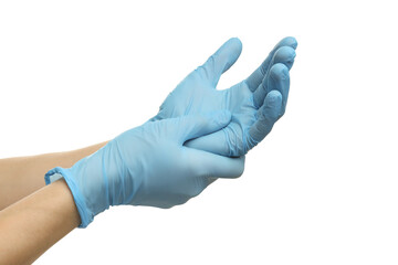 Doctor wearing light blue medical gloves on white background, closeup