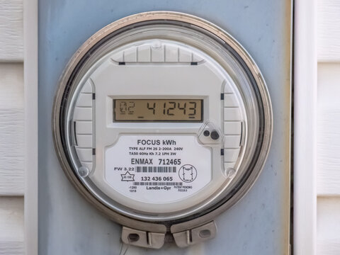 Calgary, Alberta, Canada. May 3, 2024. Close up to a house residency electric meter from EnMax a vertically integrated utility with operations across Alberta, Canada