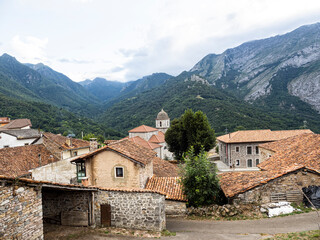 Church of the Assumption of Our Lady with the picos de europa in the background, Oseja de Sajambre, Castilla y León Community, León Province, Spain.